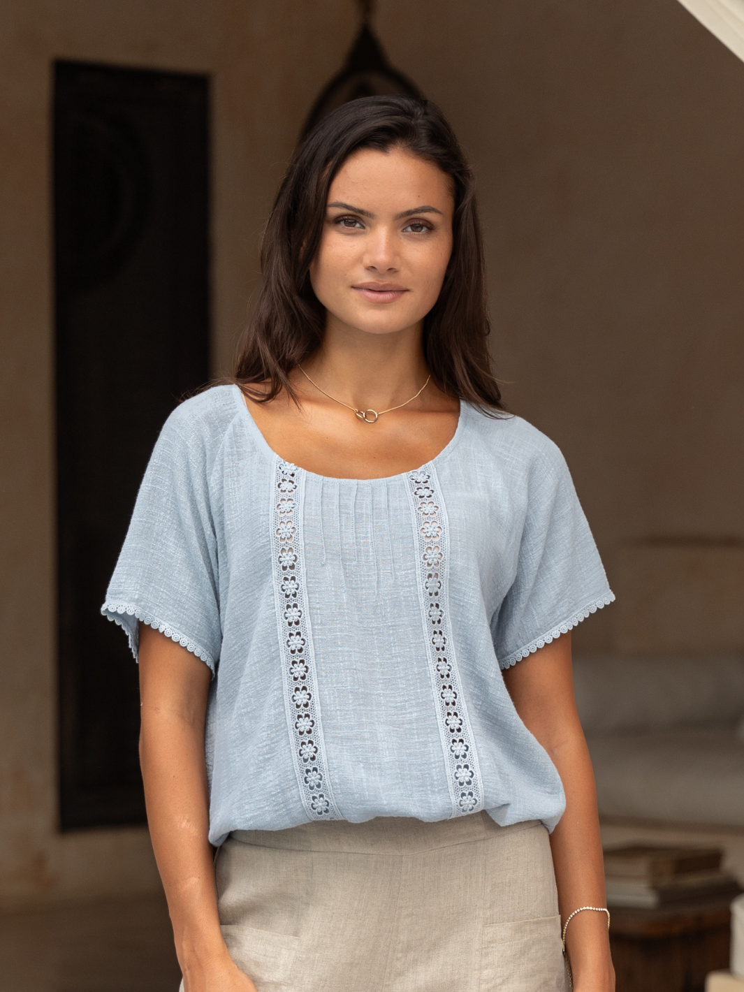 Model wears Daisy Organic Cotton Blouse Slate Blue