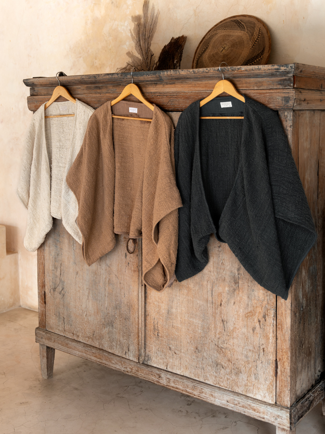 Image features Bloom Cotton Shrug in Charcoal, Desert Sand and Ecru.