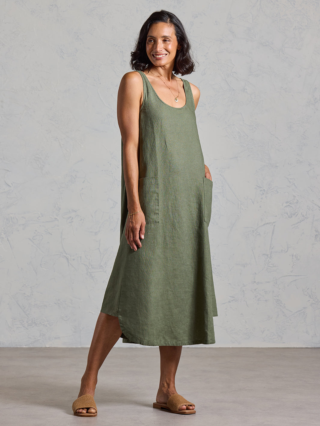 Model wearing Laurel French Linen Dress in Olive colour