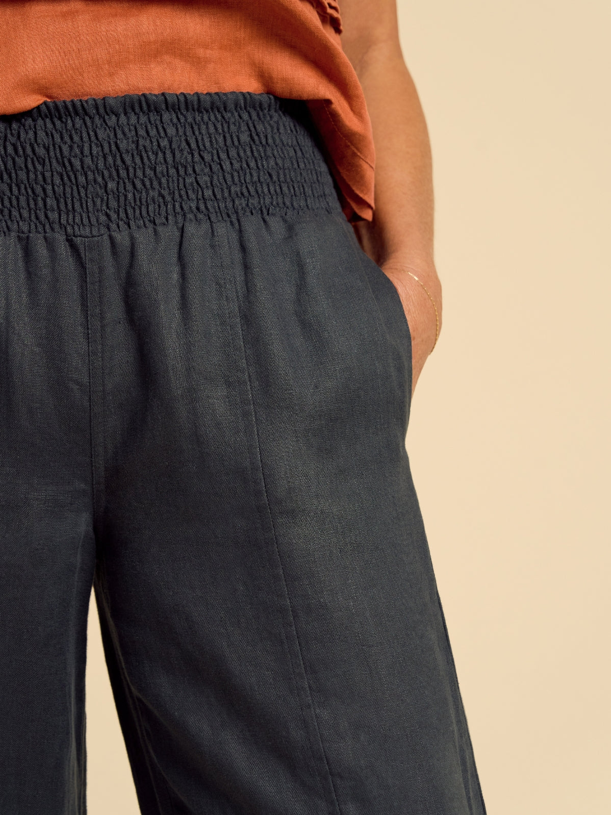 Model wears Morrissey Linen Twill Pants in Charcoal