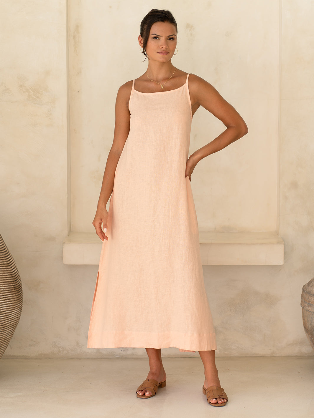 Model wears Peony Linen Dress in Coral