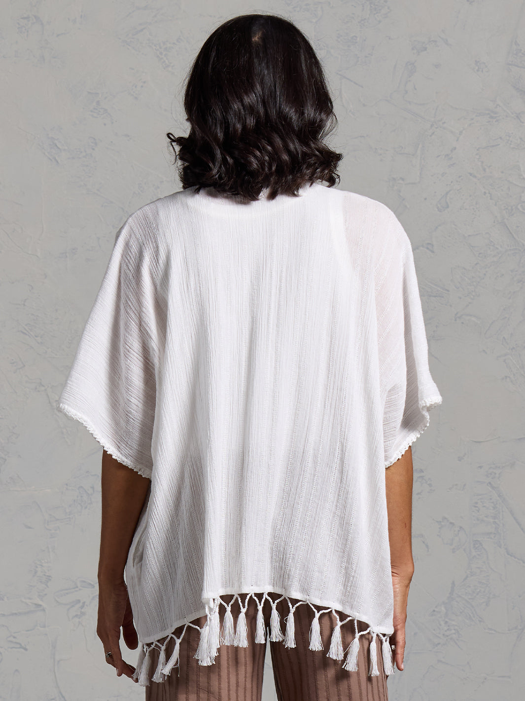Woman wearing the Solaris Cotton Kimono Coconut from Nomad the Label