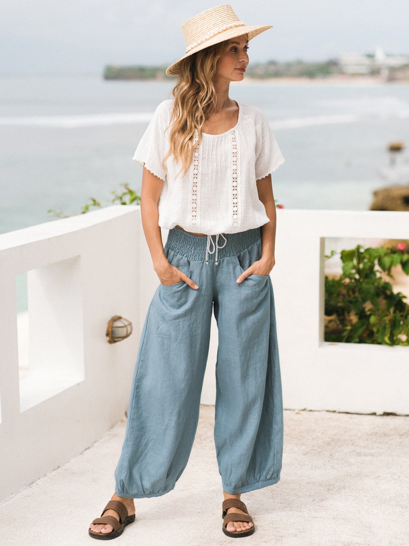 Model wears Sadhu French Linen Pants Regular in Tahiti Blue