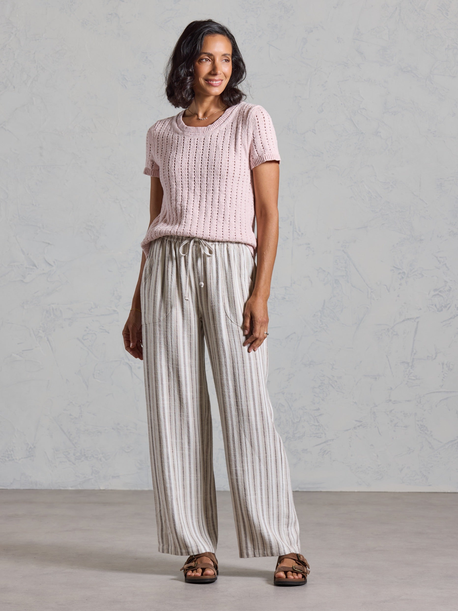 Full length view of the Jolie Linen Blend Pants in driftwood, paired with a pink knit top.