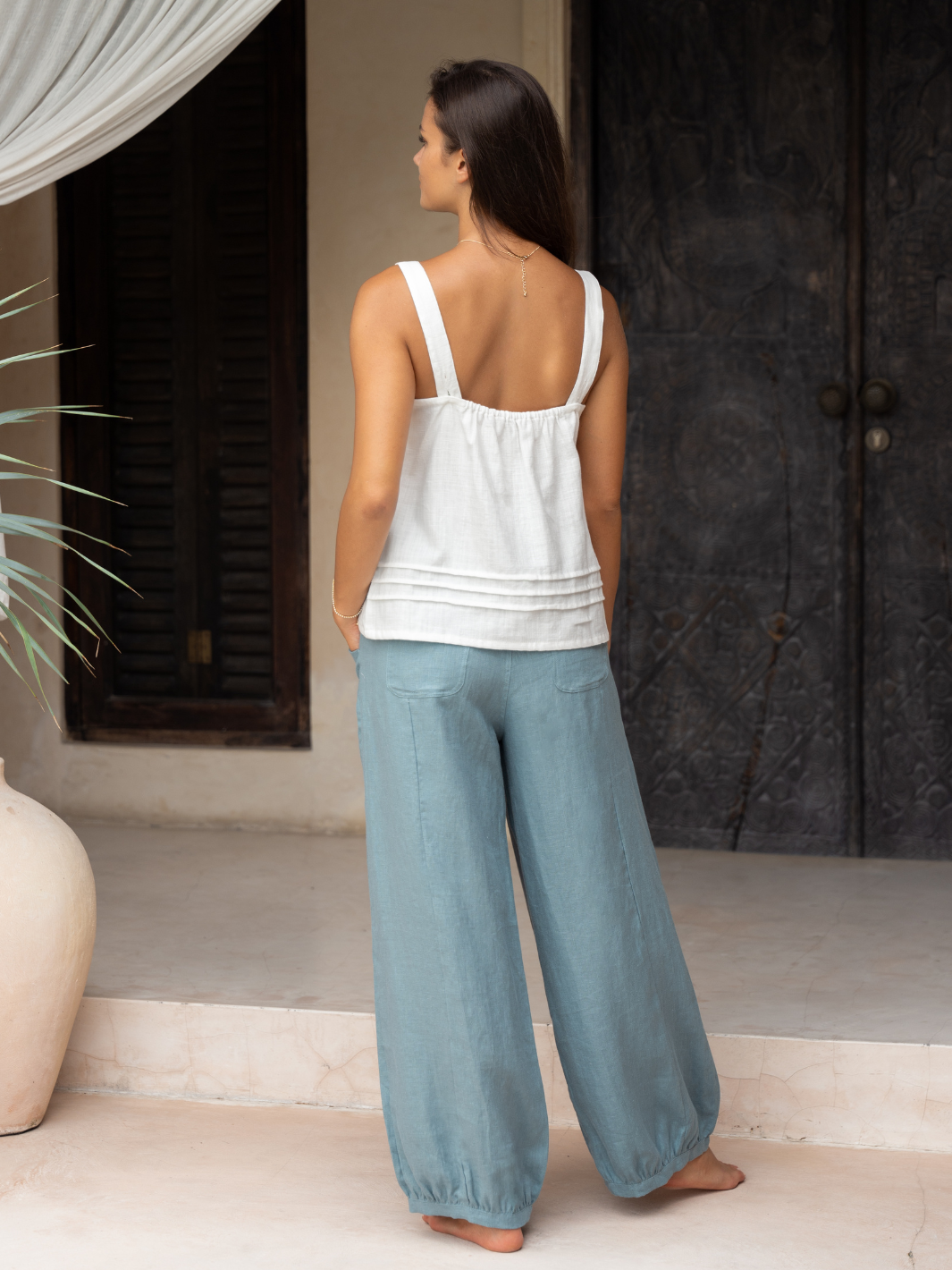 Model wears Sadhu French Linen Pants Regular in Tahiti Blue