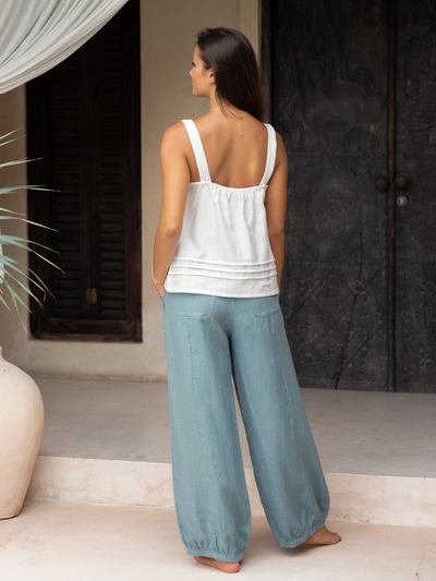 Model wears Sadhu French Linen Pants Regular in Tahiti Blue