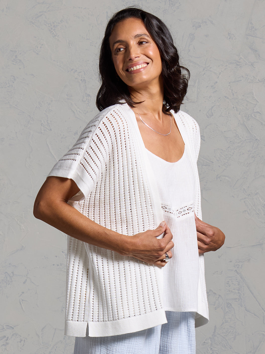 A woman wearing a coconut cotton kimono from Nomad the Label
