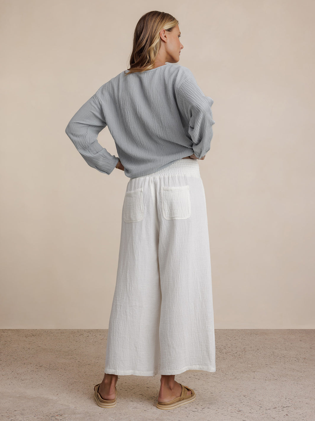 Model wears Bahama 3/4 Cotton Pants in Coconut