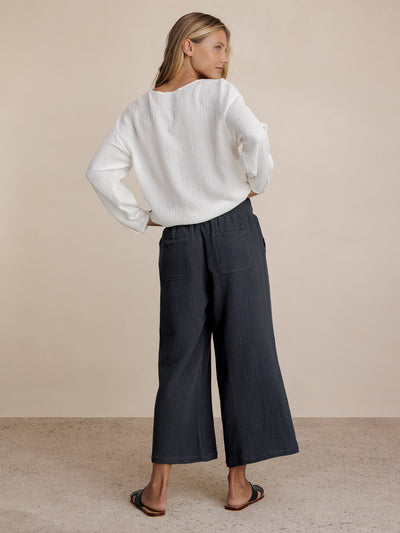 Model wears Bahama 3/4 Cotton Pants in Charcoal.