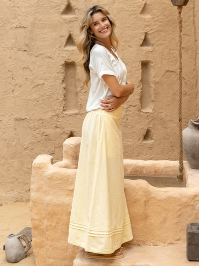 Model wears Bordeaux Cotton Skirt in Lemon