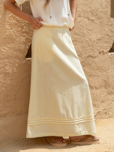 Model wears Bordeaux Cotton Skirt in Lemon