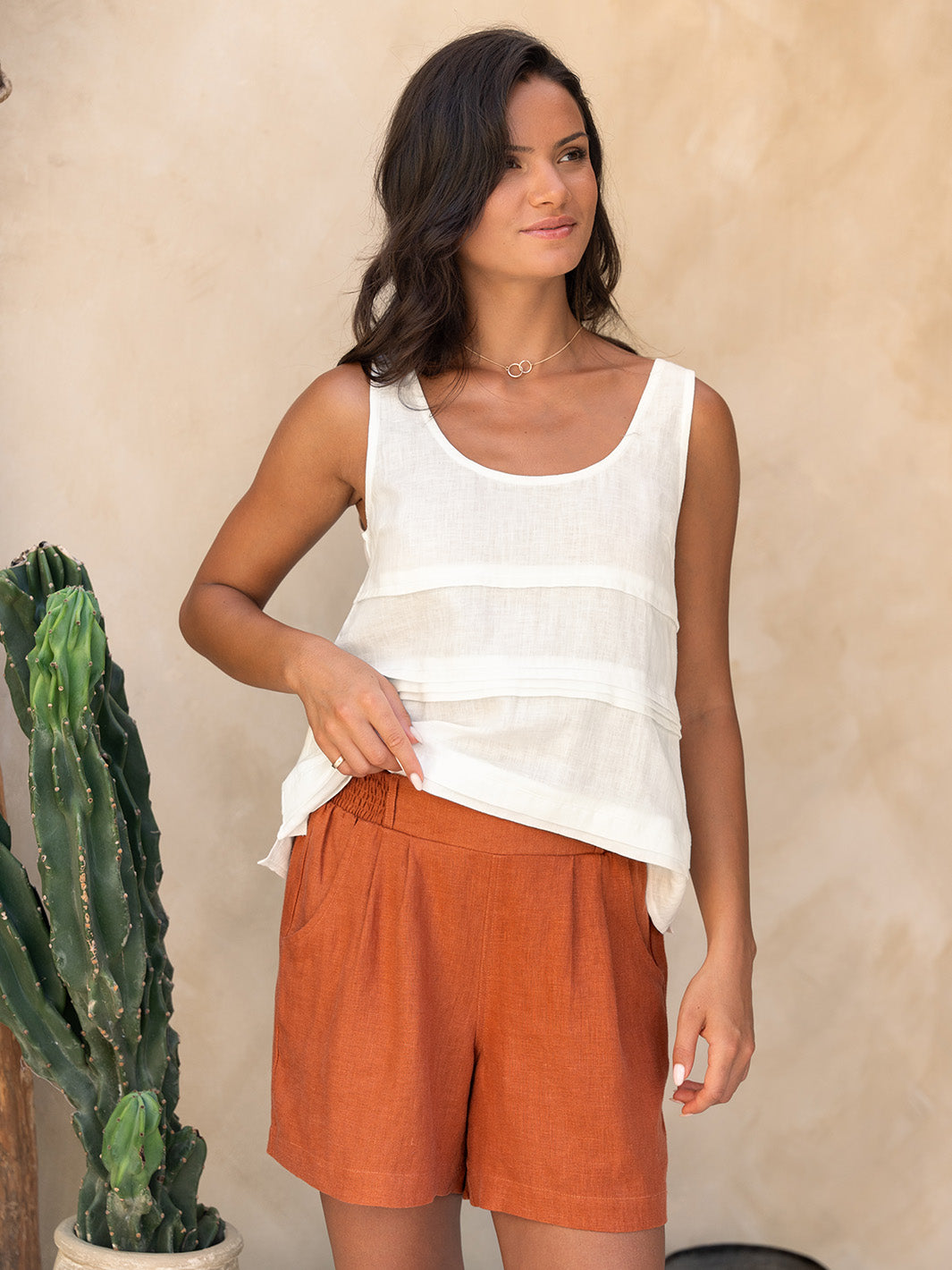 Model wears Charli Linen Shorts in Rust