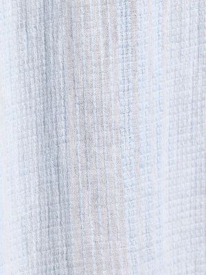 Close-up of textured fabric with horizontal stripes in light blue and gray.