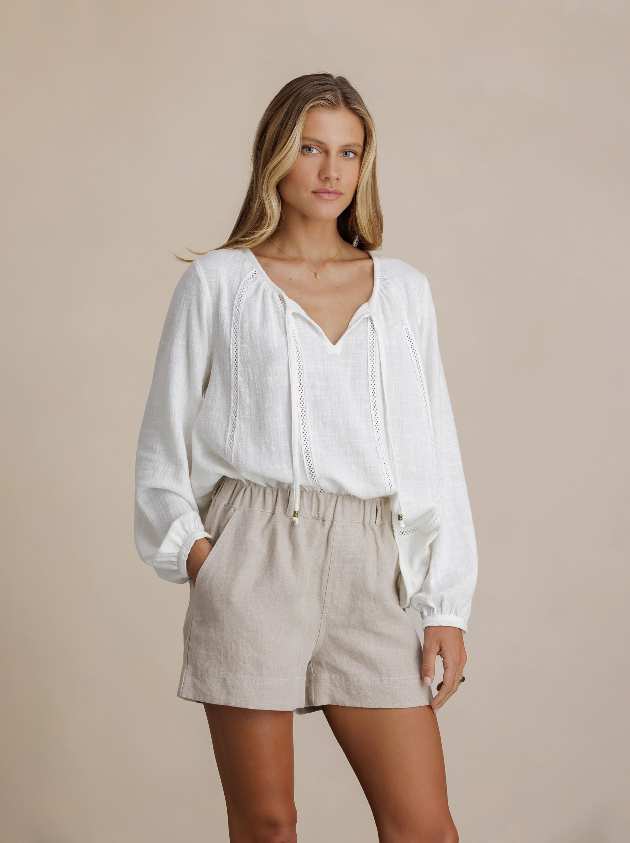 Model wears Dahlia Linen Shorts in Flax
