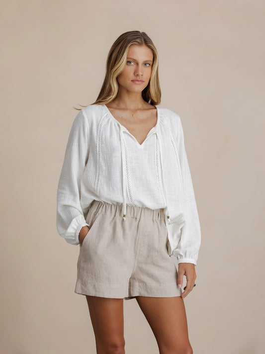 Model wears Dahlia Linen Shorts in Flax