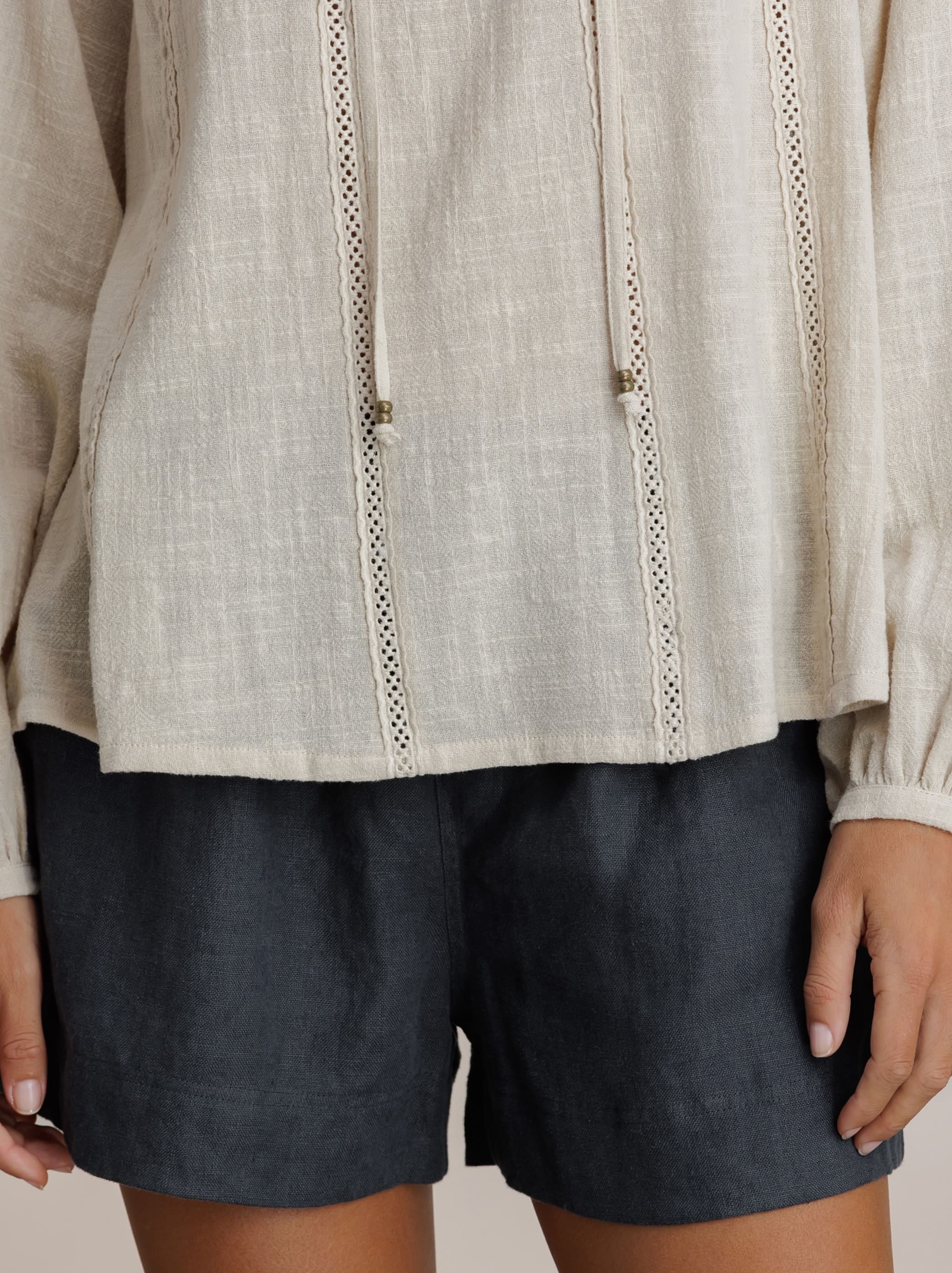 Model wears Jasmine Cotton Blouse in Stone