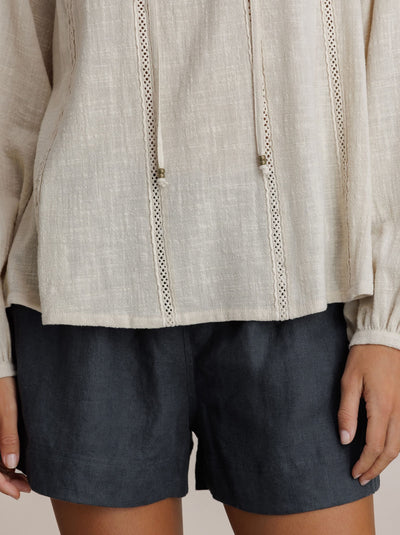 Model wears Jasmine Cotton Blouse in Stone