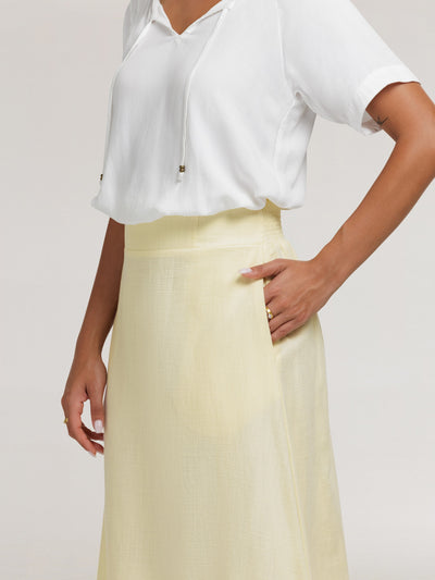 Model wears Isabella Bamboo Blouse in Ivory & Bordeaux Cotton Skirt in Lemon