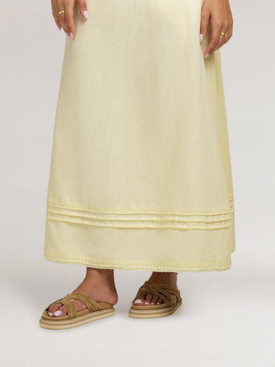 Model wears Bordeaux Cotton Skirt in Lemon