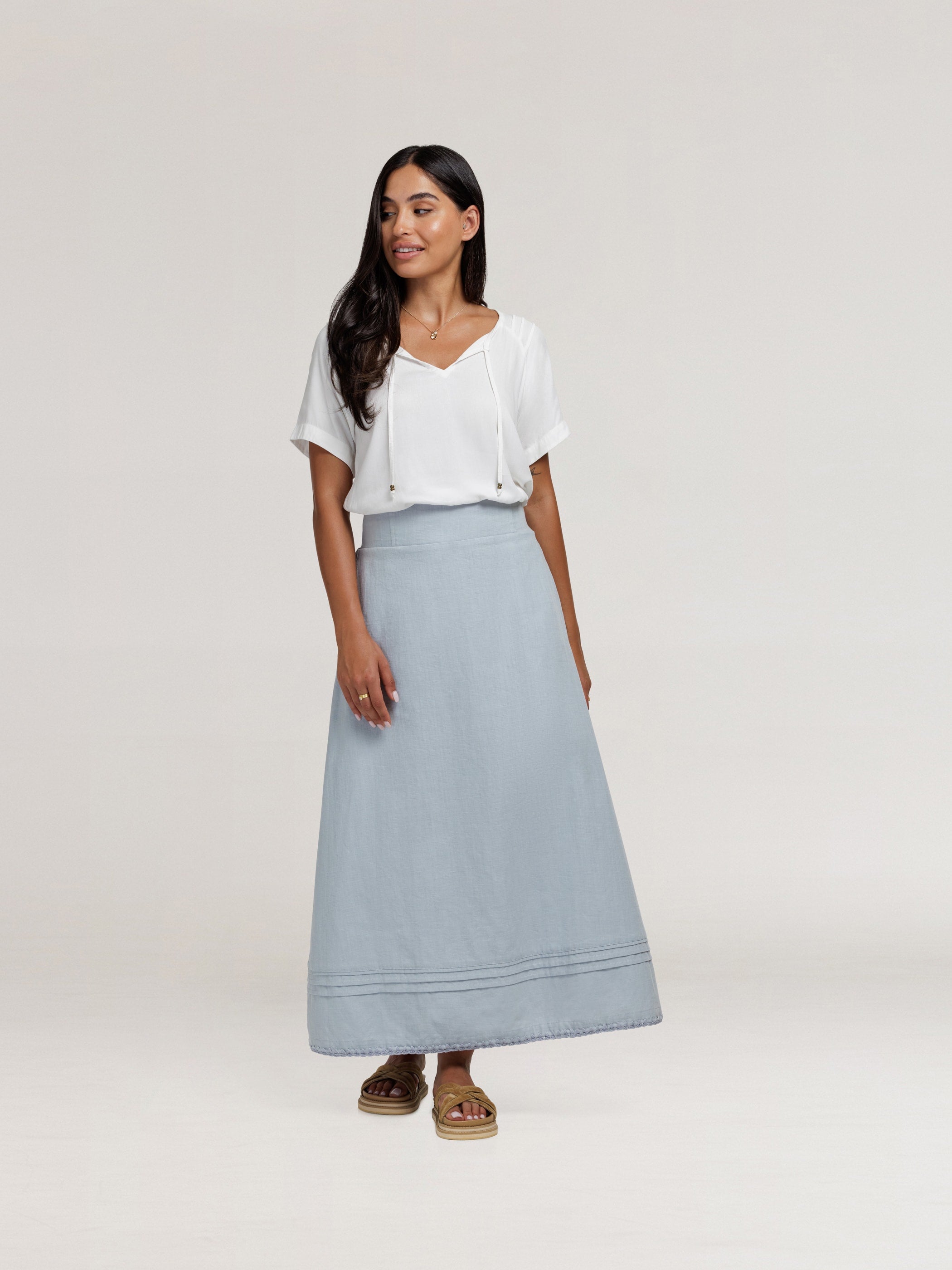 Model wears Bordeaux Cotton Skirt in Slate Blue
