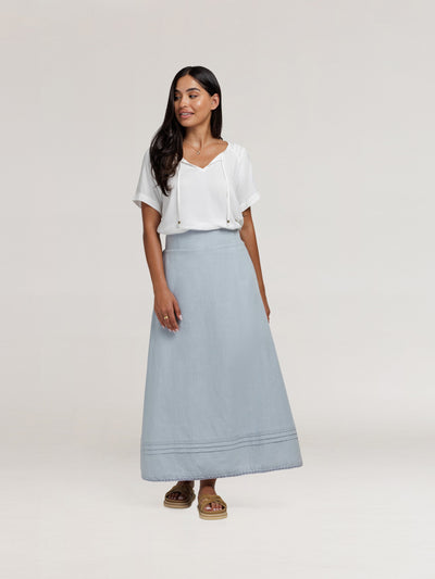 Model wears Bordeaux Cotton Skirt in Slate Blue