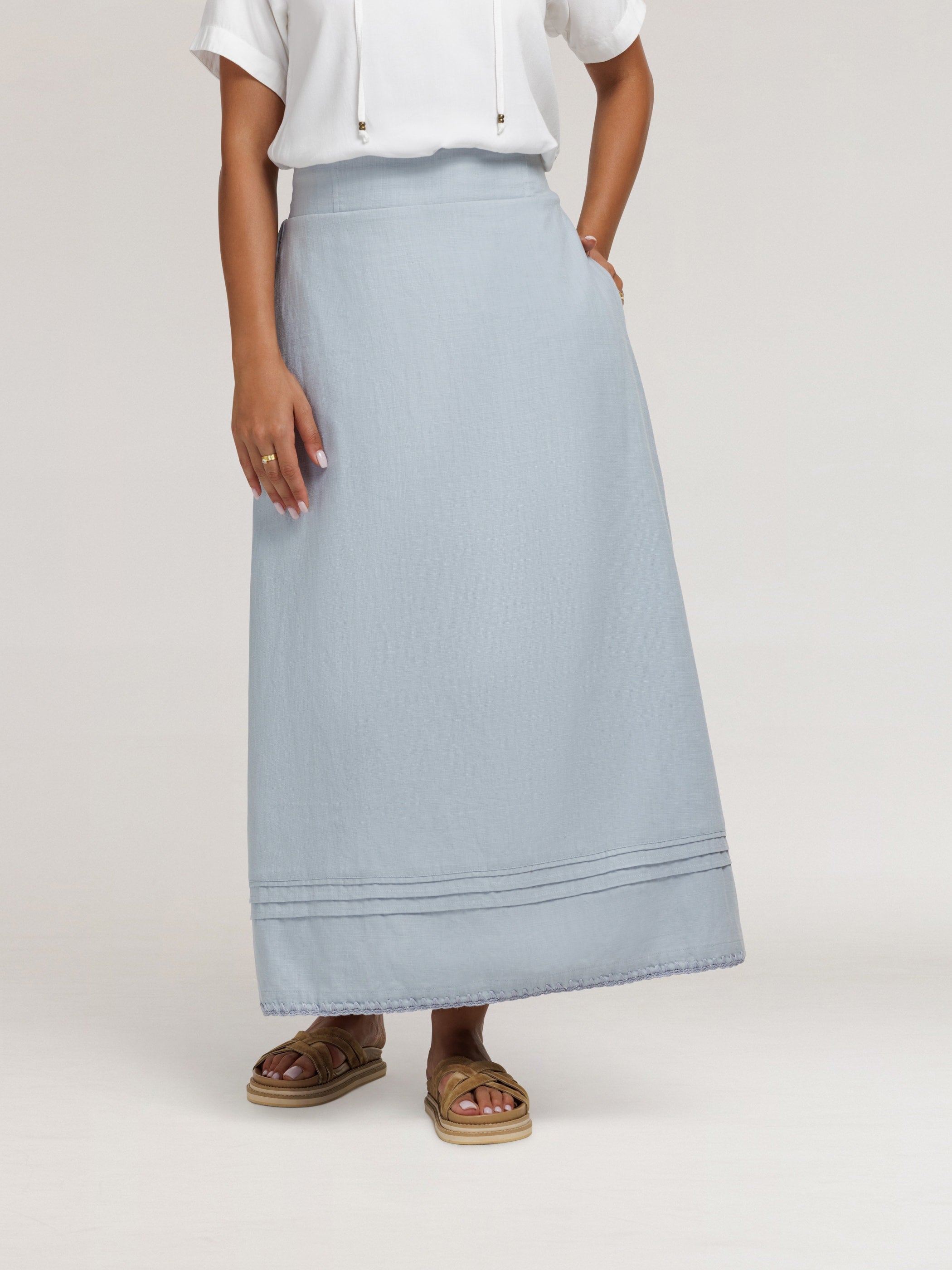 Model wears Bordeaux Cotton Skirt in Slate Blue