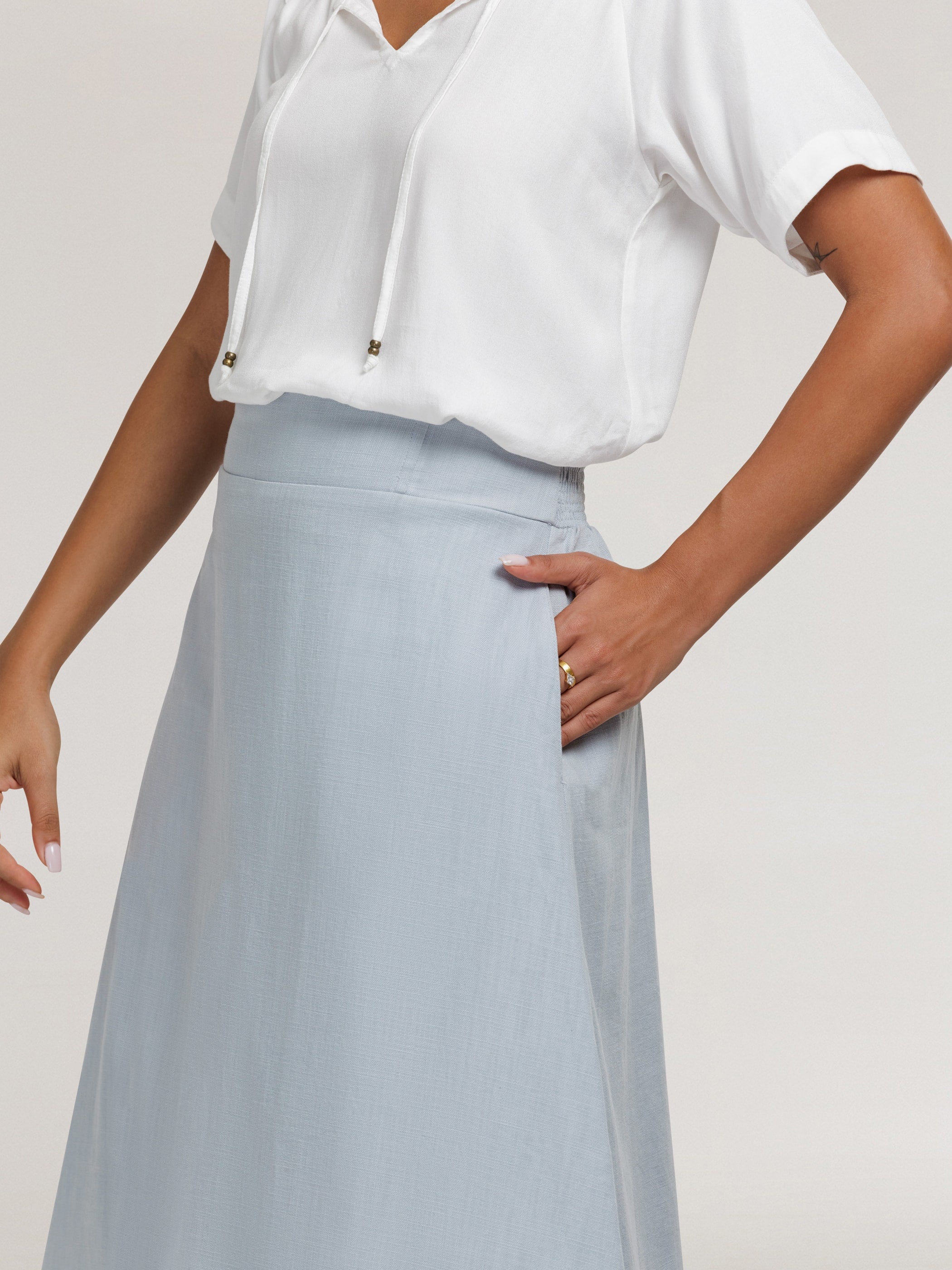 Model wears Bordeaux Cotton Skirt in Slate Blue