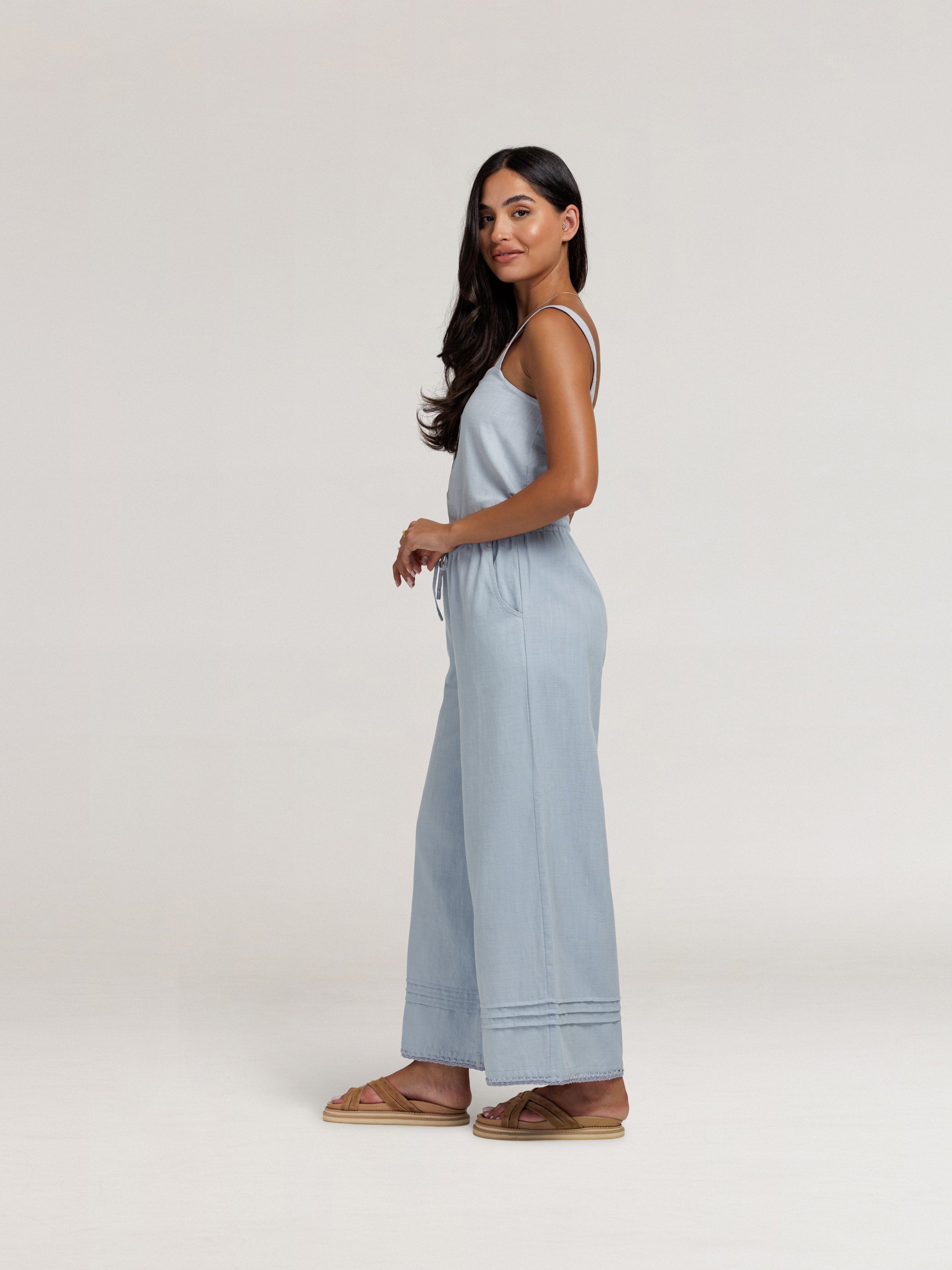 Model wears Carabella Cotton Pants in Slate Blue