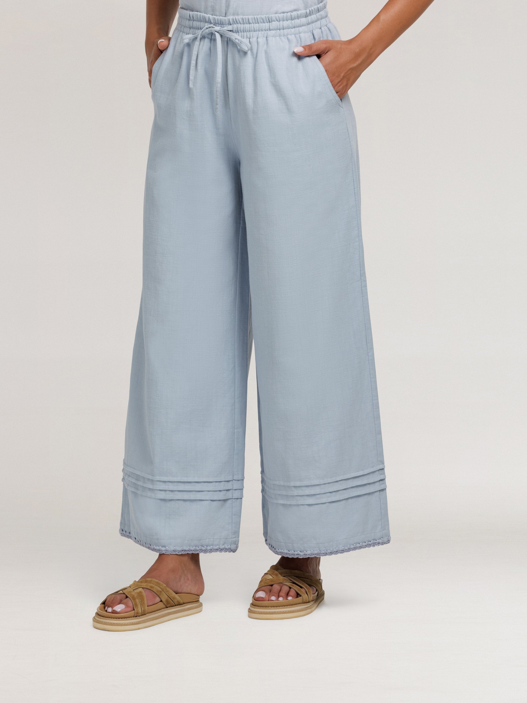 Model wears Carabella Cotton Pants in Slate Blue