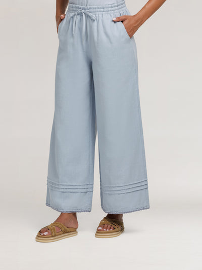 Model wears Carabella Cotton Pants in Slate Blue
