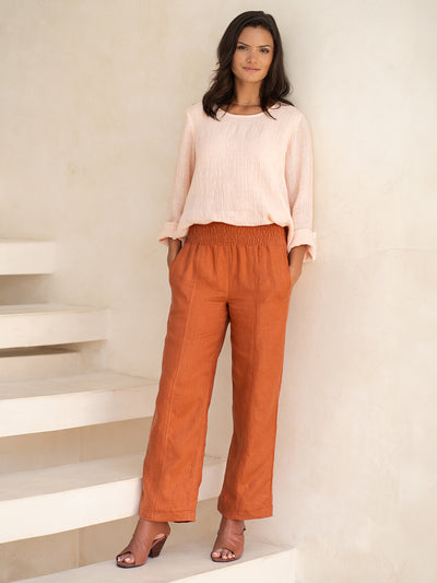 Model wears Morrissey Linen Twill Pants in Rust