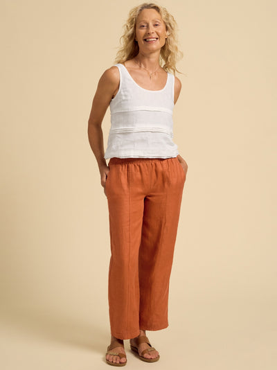 Model wears Morrissey Linen Twill Pants in Rust