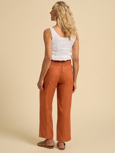 Model wears Morrissey Linen Twill Pants in Rust