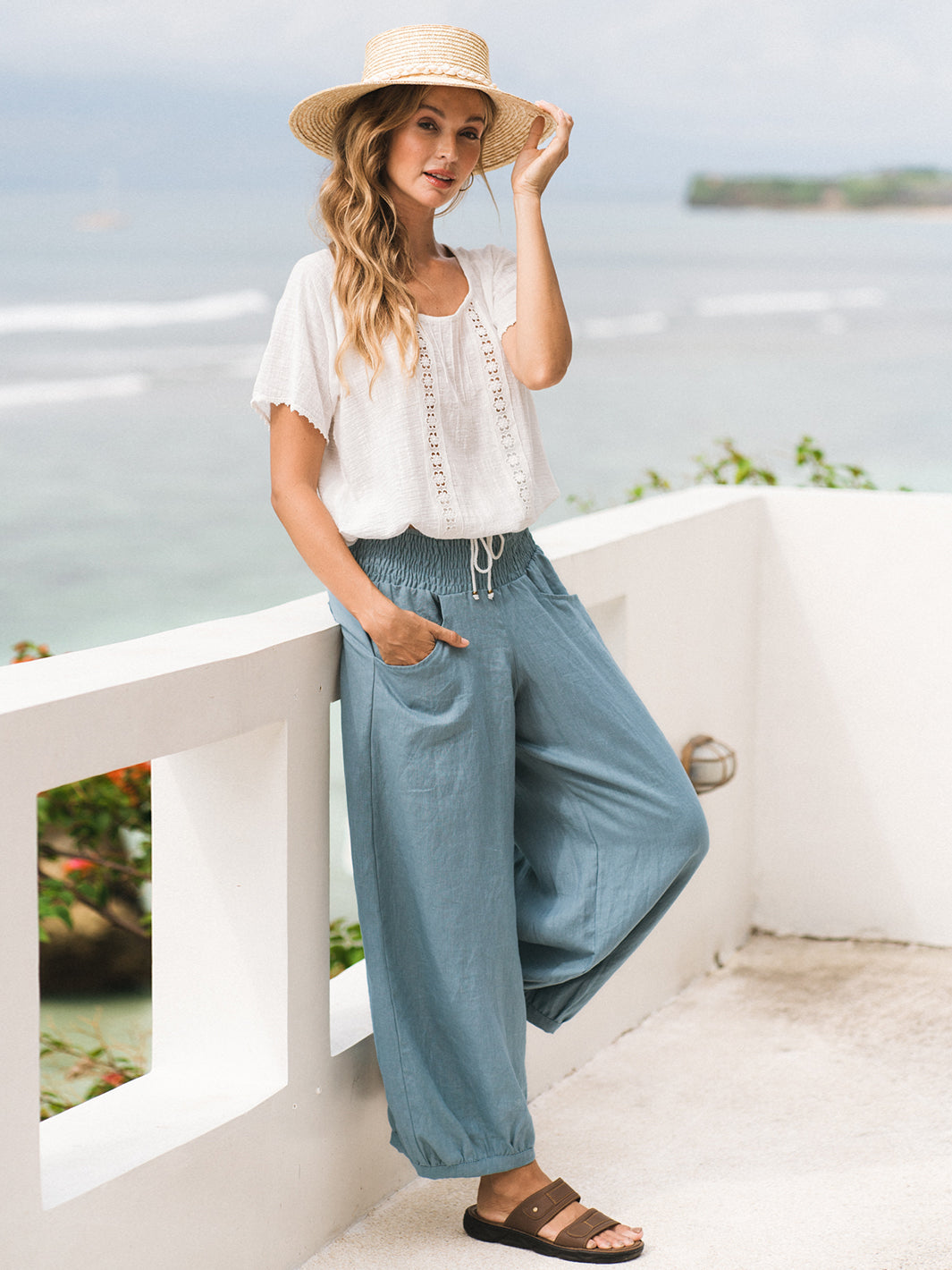 Model wears Sadhu French Linen Pants Regular in Tahiti Blue