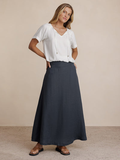 Model wears Soraya Linen Skirt in Charcoal