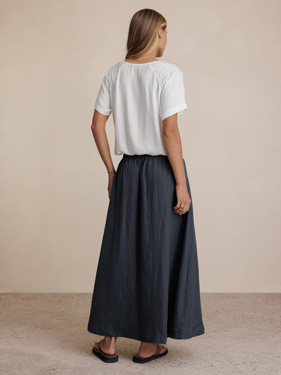 Model wears Soraya Linen Skirt in Charcoal
