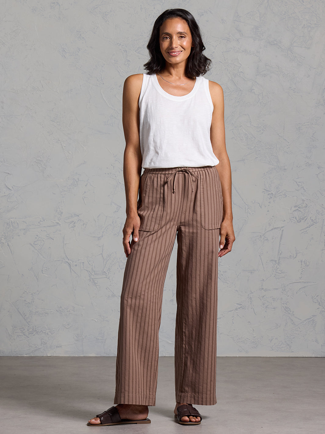 Woman wearing Sidari Organic Cotton Pants Cinnamon from Nomad the Label