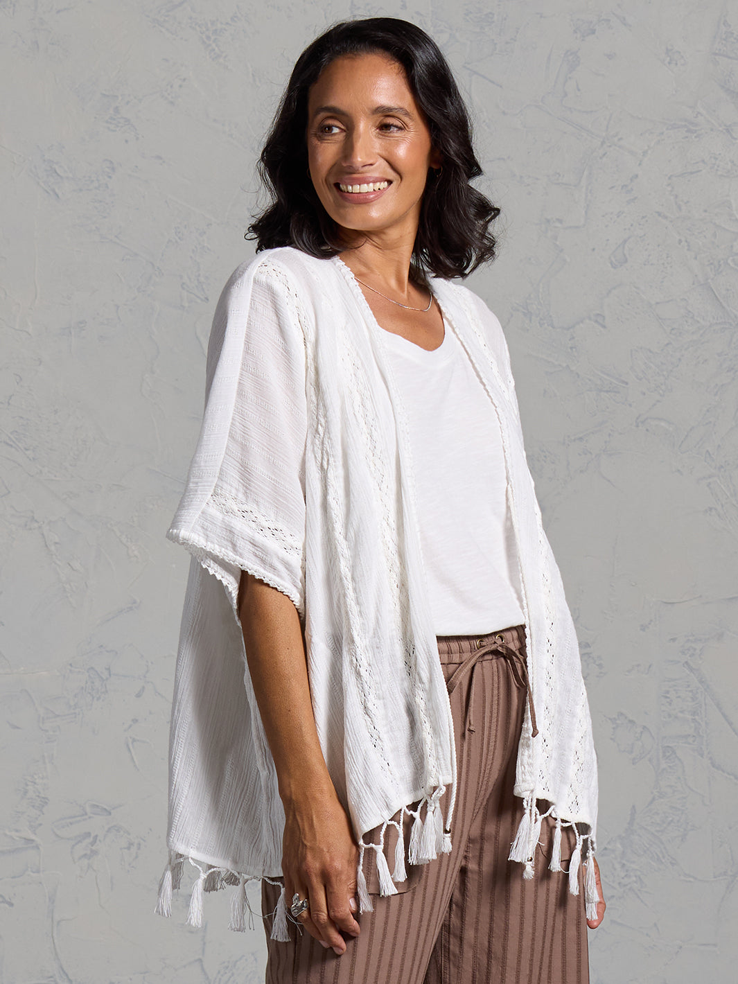 Woman wearing the Solaris Cotton Kimono Coconut from Nomad the Label