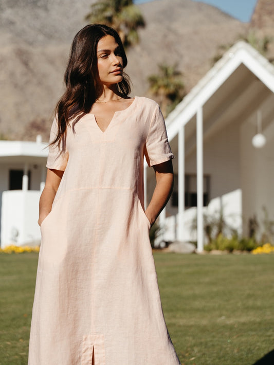 Model wearing Tulum Linen Midi Dress Seashell Pink