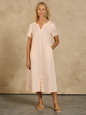 Model wearing Tulum Linen Midi Dress Seashell Pink