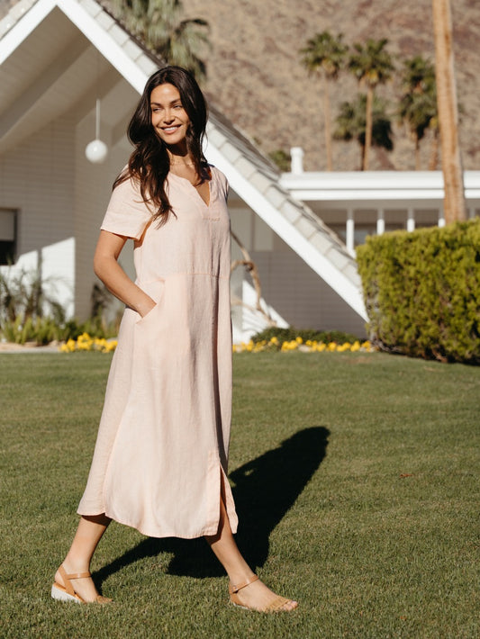 Model wearing Tulum Linen Midi Dress Seashell Pink