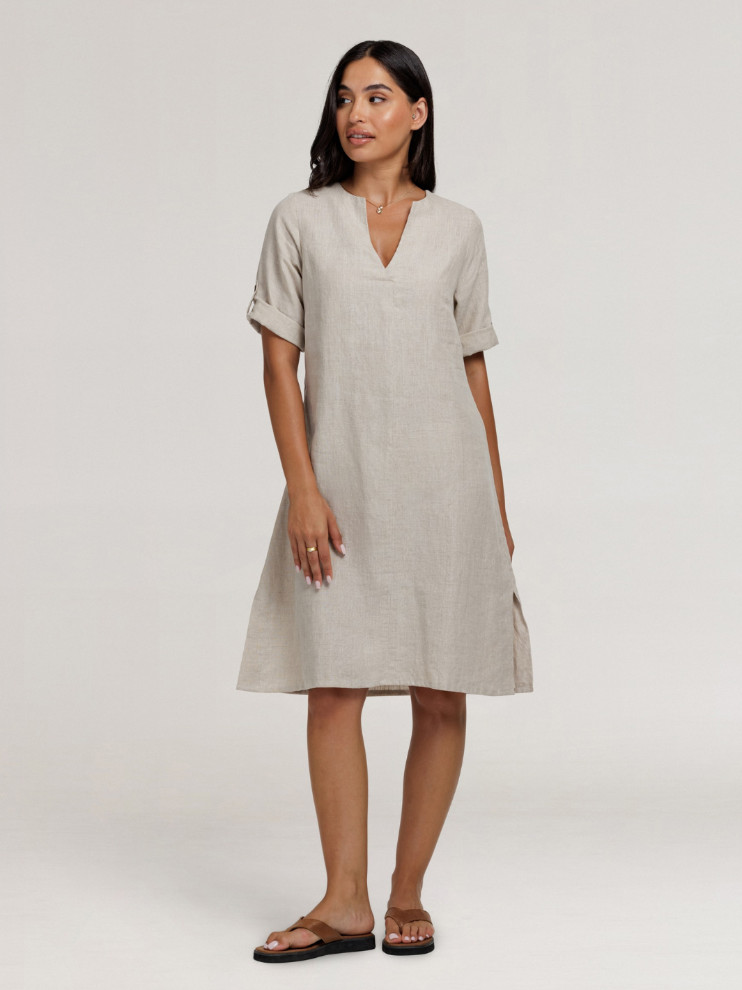 Model wears Elyse French Linen Midi Dress in Flax