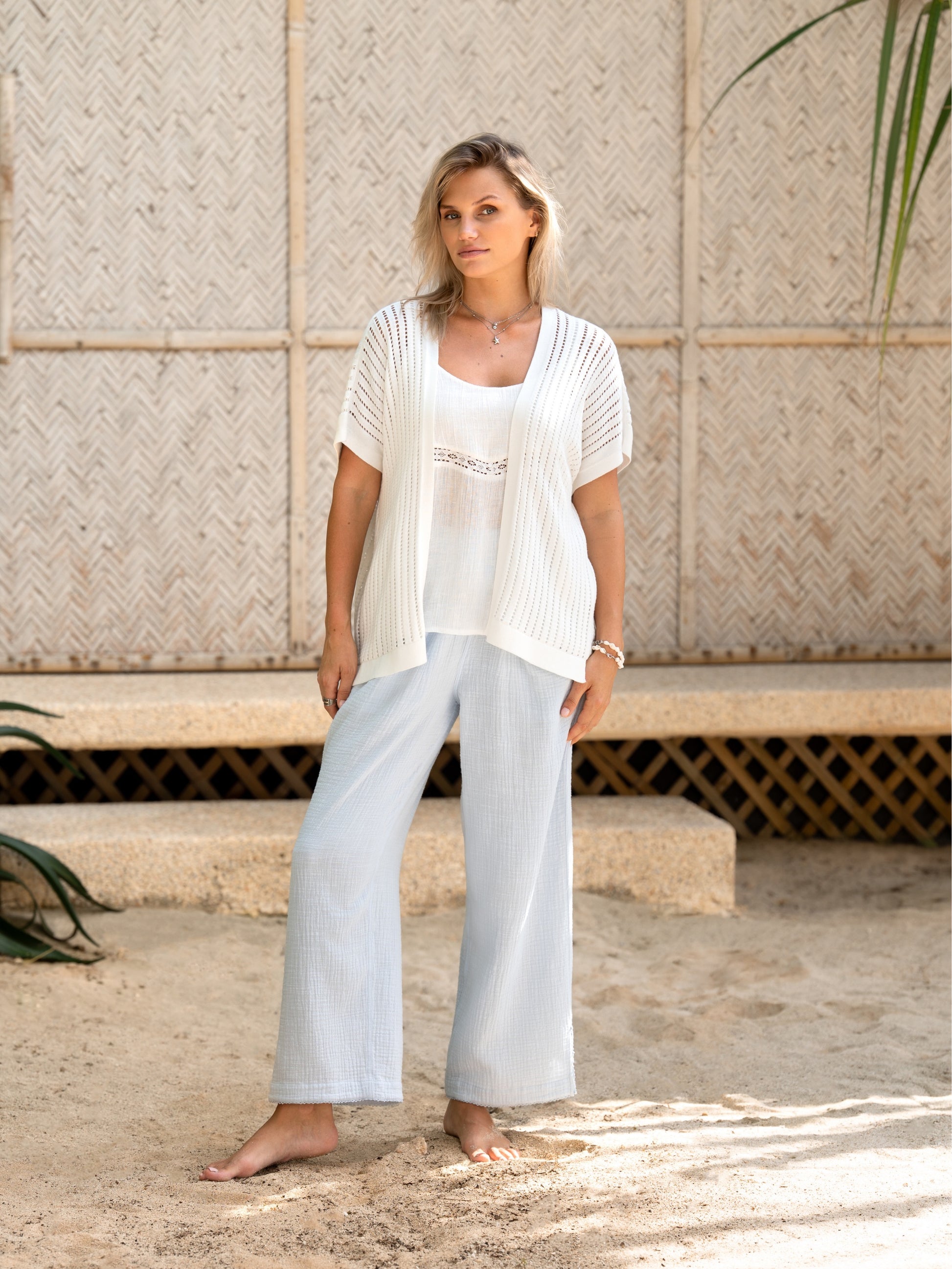 A woman wearing a coconut cotton kimono from Nomad the Label