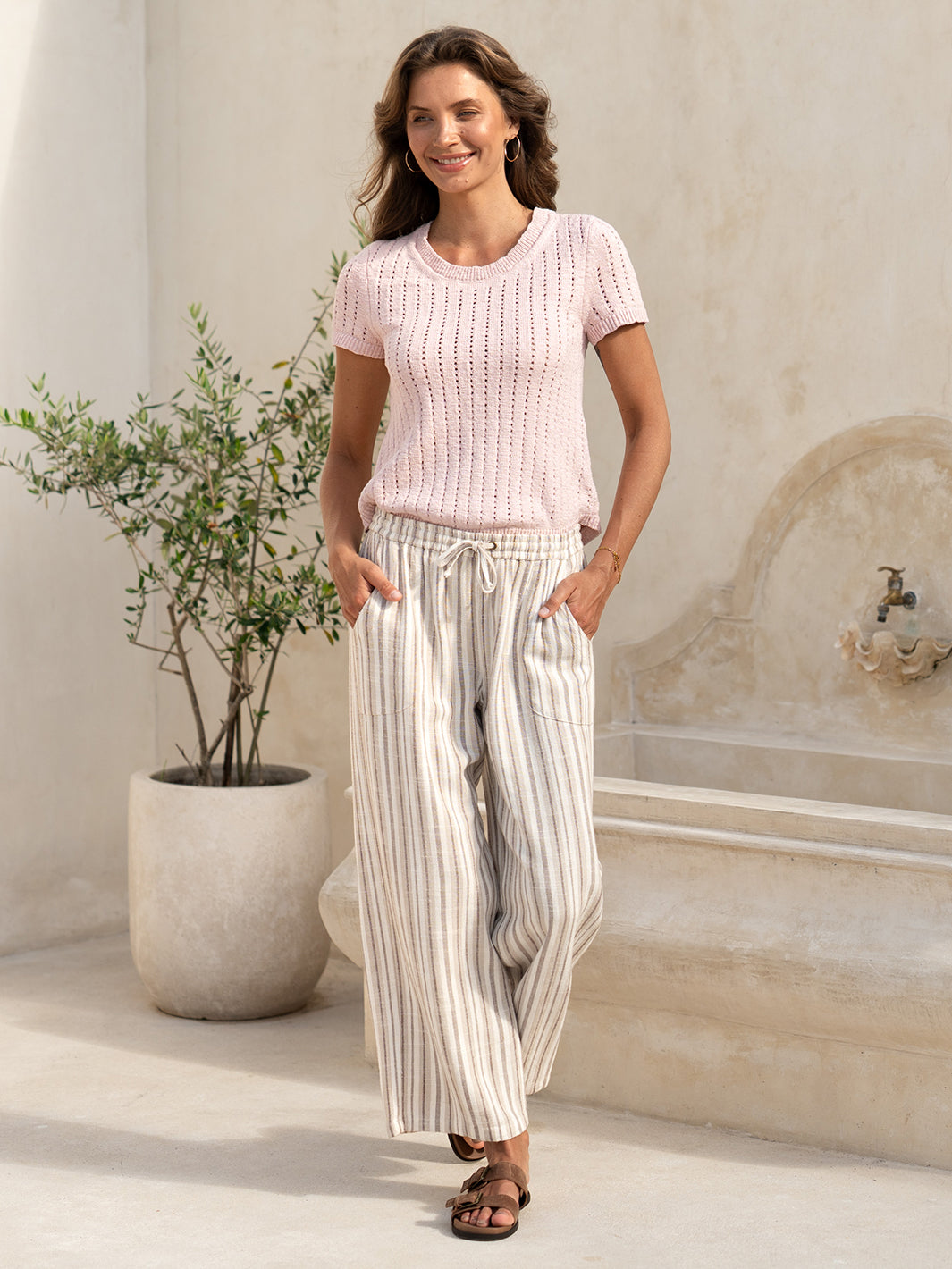 Model wearing the Jolie Linen Blend Pants in driftwood with a pink knit top