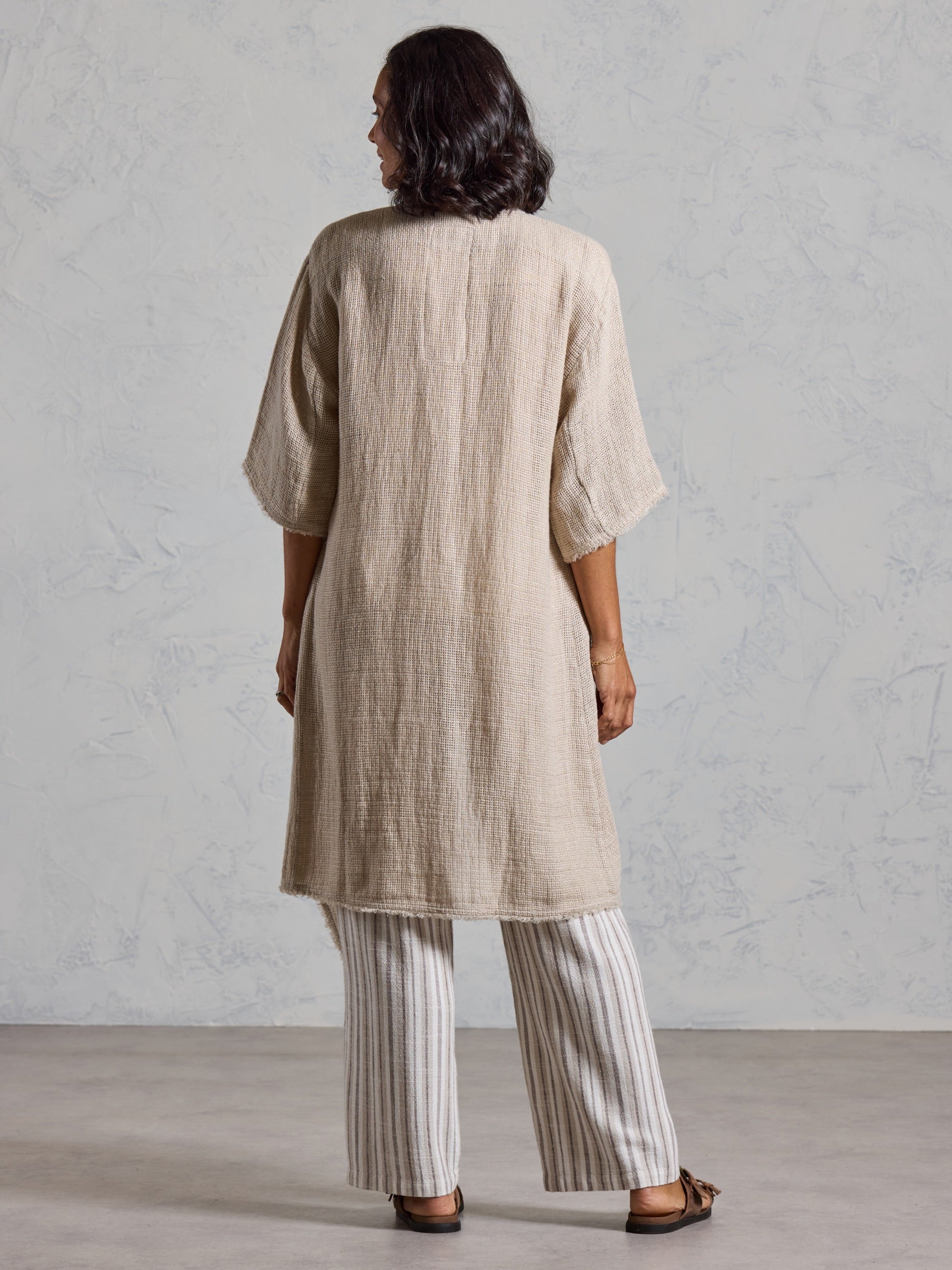 Back view of the Laguna French Linen Kimono in natural showing the textured linen weave and relaxed fit.